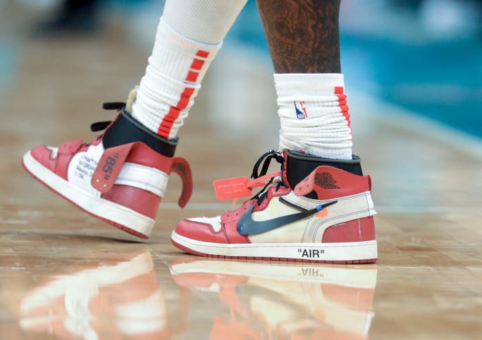 View of red and white Jordan sneakers.